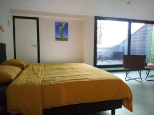 Postel nebo postele na pokoji v ubytování B&B In de Wei