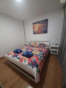 A bed or beds in a room at BRISAS DEL MAR APARTMENT, ONE STEP FROM THE SEA.