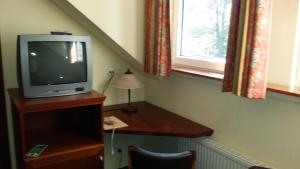 TV a/nebo společenská místnost v ubytování Hotel Restaurant Am Pfauenhof