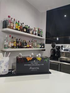 a kitchen with a bar with a box on a counter at Hotel Ciudad de Navalcarnero in Navalcarnero