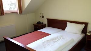 Postel nebo postele na pokoji v ubytování Hotel Restaurant Am Pfauenhof