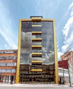 a tall building with a lot of windows at Hotel City Bog Corferias in Bogotá