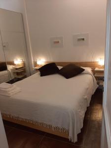 Łóżko lub łóżka w pokoju w obiekcie Loft La Corte