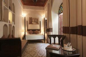 מיטה או מיטות בחדר ב-Riad Massiba