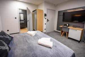 Postel nebo postele na pokoji v ubytování Wójcik SPA - Krynica Zdrój