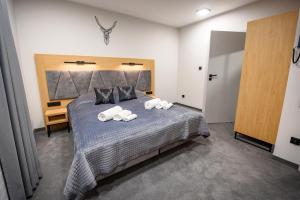 Postel nebo postele na pokoji v ubytování Wójcik SPA - Krynica Zdrój
