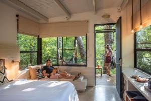 Voodi või voodid majutusasutuse Rio Perdido Hotel & Thermal River toas