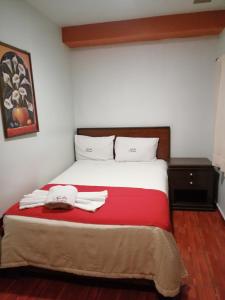 Cama o camas de una habitación en Hotel Colonial