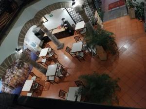 an overhead view of a lobby with tables and chairs at Hotel Colonial in Morelia