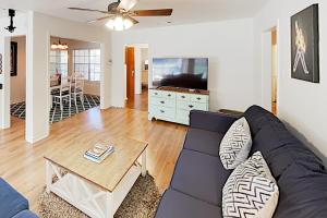 a living room with a couch and a table at South Lamar Home in Austin