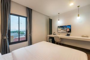 Postel nebo postele na pokoji v ubytování Nine River Hotel