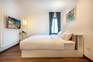 Postel nebo postele na pokoji v ubytování Nine River Hotel