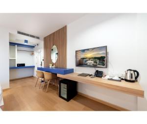 TV a/nebo společenská místnost v ubytování Nine River Hotel