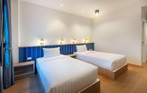 Postel nebo postele na pokoji v ubytování Nine River Hotel