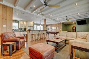 a living room filled with furniture and a kitchen at LBJ's Historic Estate in Austin