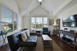 a living room with a couch and a table at Willow House Unit B in Austin