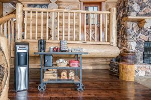 a table in a log cabin with a coffee machine at Spirit Lodge at Silverstar in Vernon