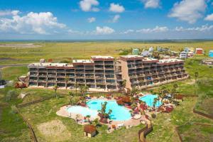an aerial view of a resort with a swimming pool at Mayan Princess Beach Condos in Padre Island