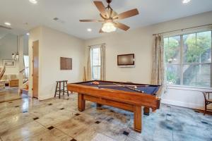 a living room with a pool table and a ceiling fan at Rosedale Hideaway in Austin