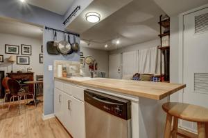 a kitchen with a counter top and a dishwasher at Creekside Terrace Condominiums #211 in Austin