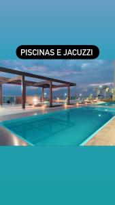ein Bild eines Pools in einem Resort in der Unterkunft Excelente apartamento pé na areia in Barra Velha + 14 Fotos