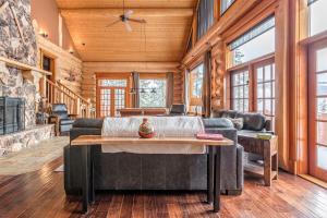 a living room with a couch and a table at Spirit Lodge at Silverstar in Vernon