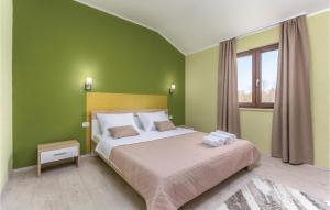 Postel nebo postele na pokoji v ubytování Three-Bedroom Holiday Home In Katun