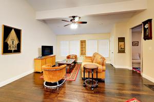 a living room with a couch and a table at Charming Delight in Austin