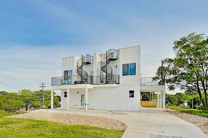 a white house with a spiral staircase on it at Blue Blossom in Austin