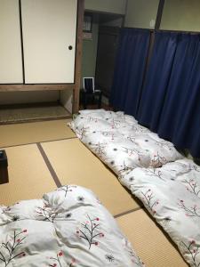 长崎卡盖米亚旅舍客房内的一张或多张床位