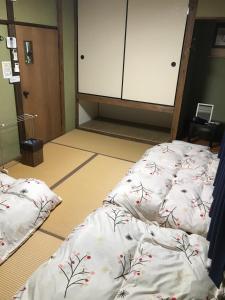 长崎卡盖米亚旅舍客房内的一张或多张床位