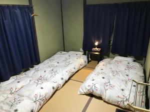 长崎卡盖米亚旅舍客房内的一张或多张床位