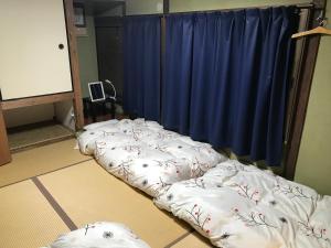 长崎卡盖米亚旅舍客房内的一张或多张床位