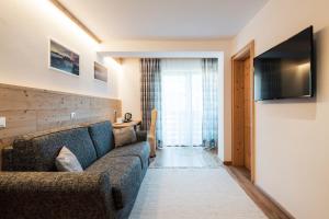 TV a/nebo společenská místnost v ubytování Piccolo Hotel Claudia No Pets