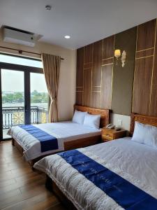 Giường trong phòng chung tại khách Sạn Yên Châu