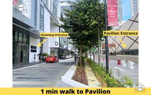 a city street with a sign that reads min walk to pavilion at Rasa Sayang Homestay at Bukit Jalil Pavilion in Kuala Lumpur