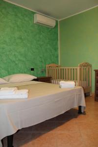 Giường trong phòng chung tại Agriturismo Agri Mediterraneo