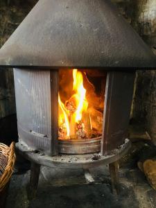 a brick oven with a fire in it at Crosskeys Inn Guest Rooms in Wye Valley in Hereford