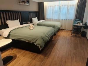 Ảnh trong thư viện ảnh của 银座精宿酒店（济南莱芜旅发印象城凤城西大街店） ở Laiwu