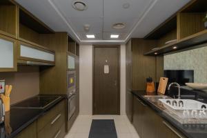 Virtuve vai virtuves zona naktsmītnē Vacay Lettings - Loft Downtown Dubai