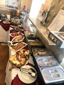 a buffet line with many different types of food at Lambach Villa Appartament 2 in Mürzzuschlag