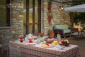 a table with a table cloth with food on it at B&B Santa Libera in Monastero Bormida +41 photos