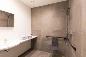 Kylpyhuone majoituspaikassa Vakantiewoning Trimaarzate