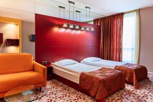 Ένα ή περισσότερα κρεβάτια σε δωμάτιο στο Monet Hotel