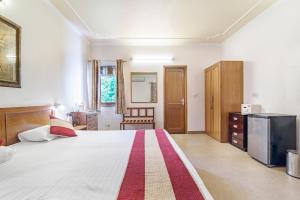Girisadan Boutique Stay客房内的一张或多张床位