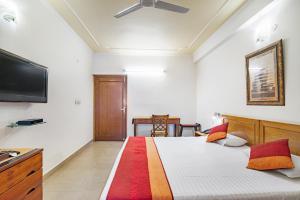 Girisadan Boutique Stay客房内的一张或多张床位