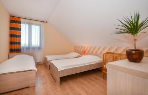 Postel nebo postele na pokoji v ubytování Apartamenty Tęczowe + 84 fotografií