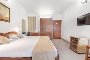 Girisadan Boutique Stay客房内的一张或多张床位