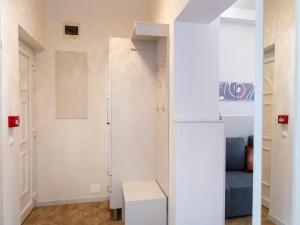 a room with a white closet with a bench in it at Mátyás Apartmanok in Hajdúszoboszló +25 photos