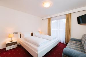 Postel nebo postele na pokoji v ubytování Hotel Gasthaus Post